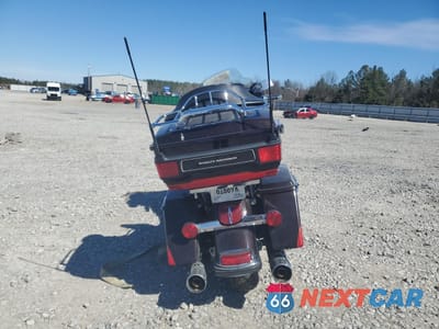 Czwarte zdjęcie samochodu z boku: 2010 HARLEY-DAVIDSON FLHTK VIN:1HD1KEM18AB648978 - miniatura