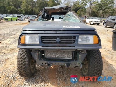 Piąte zdjęcie samochodu w środku: 1994 SUZUKI SIDEKICK JX VIN:JS3TD03V3R4101999 - miniatura