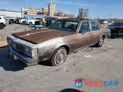 1984 OLDSMOBILE DELTA 88 ROYALE BROUGHAM 1G3AY69YXE9725875 - główne zdjęcie licytacji z USA - miniatura