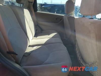 Zdjęcie 11 z 13 samochodu: 2003 MAZDA TRIBUTE LX VIN:4F2CZ94133KM29412 - miniatura