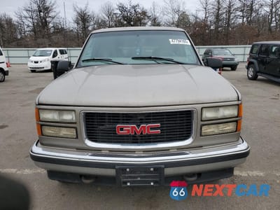 Piąte zdjęcie samochodu w środku: 1999 GMC SUBURBAN K1500 VIN:1GKFK16R5XJ708995 - miniatura