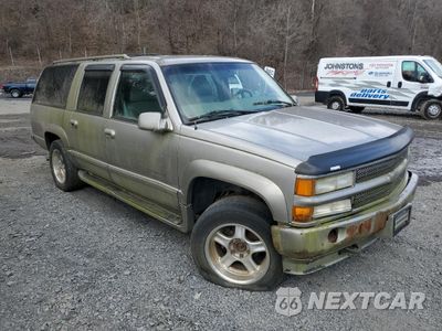 Czwarte zdjęcie samochodu z boku: 1999 CHEVROLET SUBURBAN K1500 VIN:3GNFK16R9XG193178 - miniatura