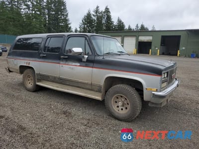 Czwarte zdjęcie samochodu z boku: 1989 GMC SUBURBAN V15 CONVENTIONAL VIN:1GKEV16K6KF511948 - miniatura