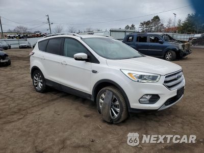 Czwarte zdjęcie samochodu z boku: 2017 FORD ESCAPE TITANIUM VIN:1FMCU9J99HUC06033 - miniatura