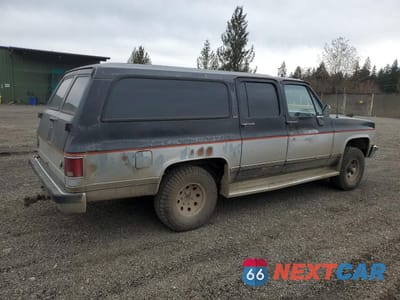 Trzecie zdjęcie samochodu z tyłu: 1989 GMC SUBURBAN V15 CONVENTIONAL VIN:1GKEV16K6KF511948 - miniatura