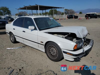 Czwarte zdjęcie samochodu z boku: 1995 BMW 540 I VIN:WBAHE5328SGA64005 - miniatura