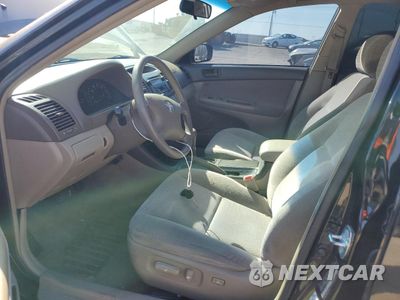 Zdjęcie 7 z 14 samochodu: 2004 TOYOTA CAMRY LE VIN:4T1BF32K24U078703 - miniatura