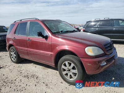 Czwarte zdjęcie samochodu z boku: 2002 MERCEDES-BENZ ML 320 VIN:4JGAB54E12A332085 - miniatura