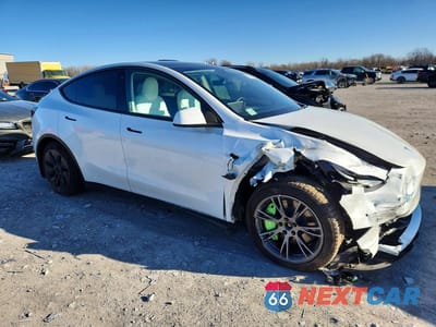 Czwarte zdjęcie samochodu z boku: 2022 TESLA MODEL Y VIN:7SAYGAEE2NF521886 - miniatura