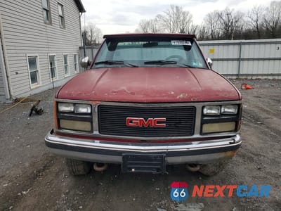 Piąte zdjęcie samochodu w środku: 1990 GMC SIERRA K1500 VIN:1GTDK14K8LE540510 - miniatura