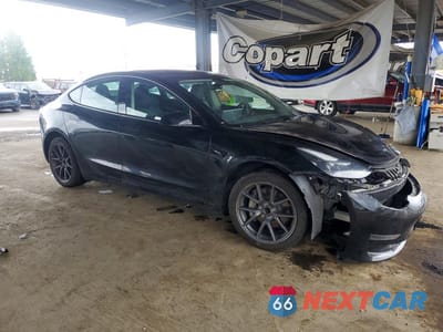 Czwarte zdjęcie samochodu z boku: 2023 TESLA MODEL 3 VIN:5YJ3E1EA7PF457406 - miniatura