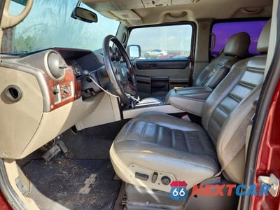Zdjęcie 7 z 12 samochodu: 2004 HUMMER H2 VIN:5GRGN23U64H104704 - miniatura