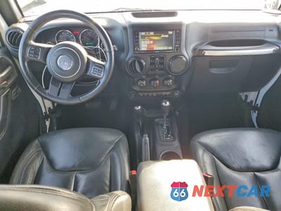 Zdjęcie 8 z 12 samochodu: 2015 JEEP WRANGLER UNLIMITED SAHARA VIN:1C4BJWEG0FL504456 - miniatura