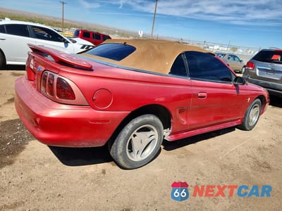 Trzecie zdjęcie samochodu z tyłu: 1997 FORD MUSTANG VIN:1FALP444XVF201105 - miniatura