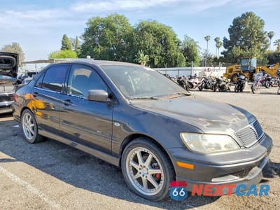 Czwarte zdjęcie samochodu z boku: 2002 MITSUBISHI LANCER OZ RALLY VIN:JA3AJ86E52U066279 - miniatura