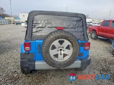 Zdjęcie 6 z 13 samochodu: 2011 JEEP WRANGLER UNLIMITED SAHARA VIN:1J4BA5H1XBL548650 - miniatura