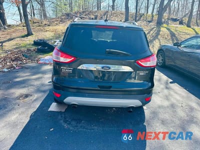 Trzecie zdjęcie samochodu z tyłu: 2014 FORD ESCAPE TITANIUM VIN:1FMCU9J98EUA54984 - miniatura