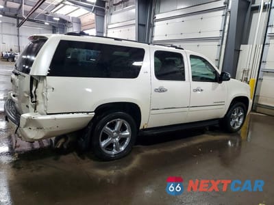 Trzecie zdjęcie samochodu z tyłu: 2012 CHEVROLET SUBURBAN K1500 LTZ VIN:1GNSKKE71CR201496 - miniatura