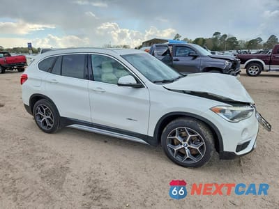 Czwarte zdjęcie samochodu z boku: 2017 BMW X1 XDRIVE28I VIN:WBXHT3C36H5F83633 - miniatura