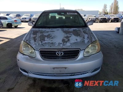 Piąte zdjęcie samochodu w środku: 2005 TOYOTA COROLLA LE VIN:1NXBR30E95Z454397 - miniatura