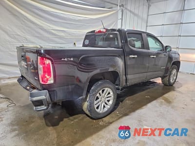 Trzecie zdjęcie samochodu z tyłu: 2017 GMC CANYON SLT VIN:1GTG6DEN4H1322333 - miniatura