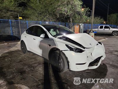 Czwarte zdjęcie samochodu z boku: 2022 TESLA MODEL Y VIN:7SAYGAEE1NF548190 - miniatura