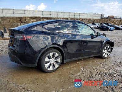 Trzecie zdjęcie samochodu z tyłu: 2023 TESLA MODEL Y VIN:7SAYGDEE2PA063770 - miniatura