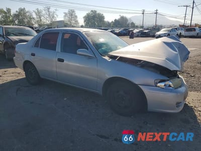 Czwarte zdjęcie samochodu z boku: 2001 TOYOTA COROLLA CE VIN:1NXBR12E11Z542629 - miniatura