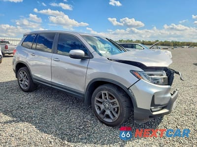 Czwarte zdjęcie samochodu z boku: 2022 HONDA PASSPORT EXL VIN:5FNYF8H59NB022426 - miniatura