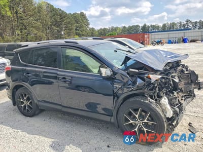 Czwarte zdjęcie samochodu z boku: 2018 TOYOTA RAV4 HYBRID SE VIN:JTMJJREVXJD215308 - miniatura