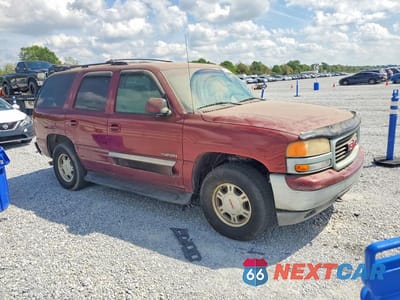 Czwarte zdjęcie samochodu z boku: 2001 GMC YUKON VIN:1GKEC13T21J252292 - miniatura