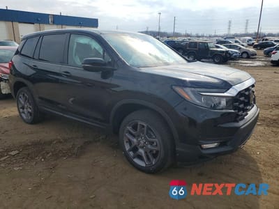 Czwarte zdjęcie samochodu z boku: 2023 HONDA PASSPORT EXL VIN:5FNYF8H5XPB032367 - miniatura