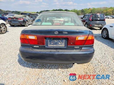Zdjęcie 6 z 12 samochodu: 1996 MAZDA PROTEGE DX VIN:JM1BB1415T0327980 - miniatura