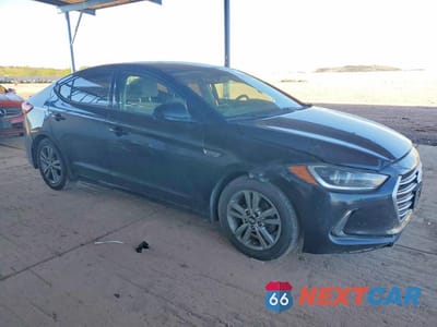 Czwarte zdjęcie samochodu z boku: 2018 HYUNDAI ELANTRA VALUE EDITION VIN:5NPD84LF3JH350454 - miniatura