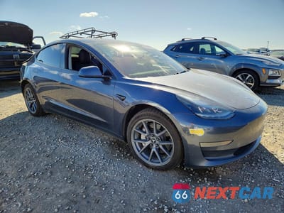 Czwarte zdjęcie samochodu z boku: 2022 TESLA MODEL 3 VIN:5YJ3E1EA2NF131848 - miniatura
