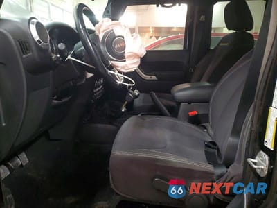 Zdjęcie 7 z 11 samochodu: 2013 JEEP WRANGLER UNLIMITED SAHARA VIN:1C4BJWEG8DL509580 - miniatura