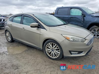 Czwarte zdjęcie samochodu z boku: 2016 FORD FOCUS TITANIUM VIN:1FADP3N2XGL302922 - miniatura