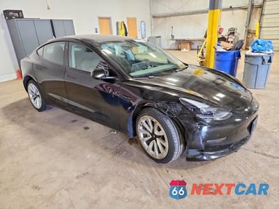 Czwarte zdjęcie samochodu z boku: 2023 TESLA MODEL 3 VIN:5YJ3E1EA3PF431062 - miniatura
