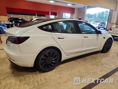 Trzecie zdjęcie samochodu z tyłu: 2023 TESLA MODEL 3 VIN:5YJ3E1EC3PF632753 - miniatura