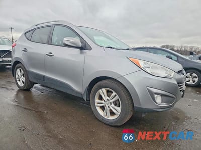 Czwarte zdjęcie samochodu z boku: 2013 HYUNDAI TUCSON GLS VIN:KM8JUCAC0DU573736 - miniatura