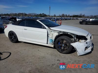 Czwarte zdjęcie samochodu z boku: 2015 BMW M6 VIN:WBSLZ9C57FD651473 - miniatura