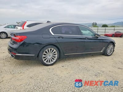 Trzecie zdjęcie samochodu z tyłu: 2016 BMW 740 I VIN:WBA7E2C50GG504663 - miniatura