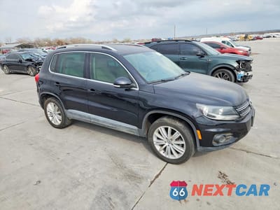 Czwarte zdjęcie samochodu z boku: 2014 VOLKSWAGEN TIGUAN S VIN:WVGAV3AX9EW505134 - miniatura