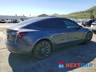 Trzecie zdjęcie samochodu z tyłu: 2023 TESLA MODEL 3 VIN:5YJ3E1EC0PF576366 - miniatura
