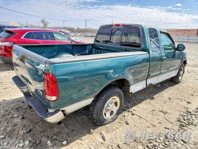 Trzecie zdjęcie samochodu z tyłu: 1999 FORD F150 VIN:1FTZX1723XNC13215 - miniatura