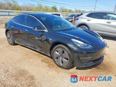 Czwarte zdjęcie samochodu z boku: 2019 TESLA MODEL 3 VIN:5YJ3E1EA3KF400029 - miniatura