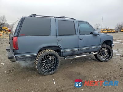 Trzecie zdjęcie samochodu z tyłu: 1999 GMC YUKON VIN:1GKEC13R9XJ755573 - miniatura