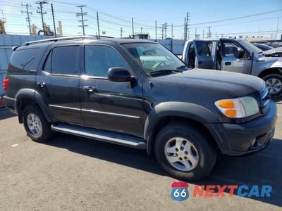 Czwarte zdjęcie samochodu z boku: 2002 TOYOTA SEQUOIA LIMITED VIN:5TDBT48AX2S124555 - miniatura