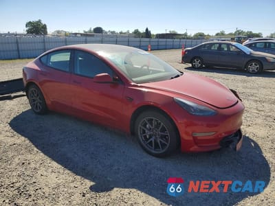 Czwarte zdjęcie samochodu z boku: 2023 TESLA MODEL 3 VIN:5YJ3E1EA7PF594264 - miniatura