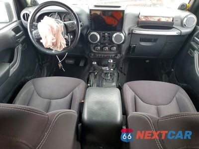 Zdjęcie 8 z 12 samochodu: 2014 JEEP WRANGLER UNLIMITED SAHARA VIN:1C4BJWEG5EL140629 - miniatura